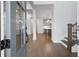 Bright foyer featuring hardwood floors and view of the kitchen and staircase at 535 Pearl St, Cumming, GA 30040