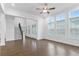 Bright living room with a staircase, large windows and French doors, and hardwood floors at 535 Pearl St, Cumming, GA 30040