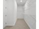 Bright walk-in closet with carpet floors and wire shelving for optimal storage at 535 Pearl St, Cumming, GA 30040