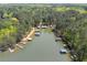Aerial view showcasing waterfront properties, docks, and lush greenery, providing a serene lakeside living experience at 803 Willow Oak Dr, Woodstock, GA 30189