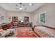 Versatile bedroom with a ceiling fan, window, desk, daybed, and bookshelves at 803 Willow Oak Dr, Woodstock, GA 30189