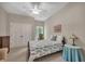 Bedroom showcasing a double closet, a bed with patterned bedding, and an accent table with a lamp at 803 Willow Oak Dr, Woodstock, GA 30189