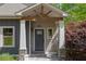 Elegant home entrance featuring a stylish front door with decorative accents and stone pillars at 803 Willow Oak Dr, Woodstock, GA 30189