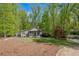 Attractive house on a lawn with mature trees, providing ample shade and curb appeal at 803 Willow Oak Dr, Woodstock, GA 30189