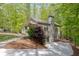 Exterior view of a home with a two-car garage and stone accents on the side at 803 Willow Oak Dr, Woodstock, GA 30189