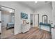 Hallway with wood floors, neutral paint, and doorways leading to bedrooms at 803 Willow Oak Dr, Woodstock, GA 30189