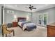 This main bedroom features natural light and a decorative ceiling fan at 803 Willow Oak Dr, Woodstock, GA 30189