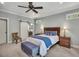 This main bedroom offers a ceiling fan, ensuite bath, and neutral colors at 803 Willow Oak Dr, Woodstock, GA 30189