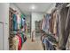 Spacious walk-in closet with custom shelving and ample storage for clothing and shoes at 803 Willow Oak Dr, Woodstock, GA 30189