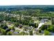 Community aerial view of a neighborhood surrounded by lush greenery and a lake nearby at 101 Javay Ct Ct, Villa Rica, GA 30180