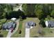 An aerial view shows the home nestled in a community with verdant surroundings and an extended driveway at 101 Javay Ct Ct, Villa Rica, GA 30180