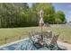 A peaceful patio featuring a table, chairs, and umbrella is perfect for relaxing and enjoying the outdoors at 101 Javay Ct Ct, Villa Rica, GA 30180