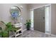 Stylish entryway with a decorative mirror, console table, wood floors, and attractive plants at 101 Javay Ct Ct, Villa Rica, GA 30180