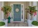 Inviting front entrance featuring a decorated door, potted plants, and decorative welcome sign at 101 Javay Ct Ct, Villa Rica, GA 30180