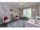 This home office features a modern desk, plush seating, and calming decor for a productive workspace at 101 Javay Ct Ct, Villa Rica, GA 30180