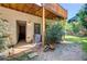Outdoor patio area with wood deck, lush landscaping, and shady trees at 1015 Heatherbrooke Ln, Atlanta, GA 30324