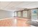 A basement space with three windows, a door to the outside, and laminate flooring at 1015 Heatherbrooke Ln, Atlanta, GA 30324