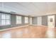 Spacious basement area with hardwood floors, three windows, and ample lighting at 1015 Heatherbrooke Ln, Atlanta, GA 30324