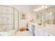 A serene bathroom with a glass shower, double vanity, and decorative touches at 1015 Heatherbrooke Ln, Atlanta, GA 30324