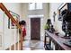 Inviting foyer with hardwood floors and stylish decor leading into the home at 1015 Heatherbrooke Ln, Atlanta, GA 30324