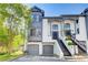Elegant townhome featuring a two-car garage and grand entrance staircase at 1015 Heatherbrooke Ln, Atlanta, GA 30324