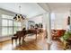 Spacious living room with hardwood floors, large windows, and a grand chandelier at 1015 Heatherbrooke Ln, Atlanta, GA 30324