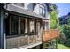 Inviting screened porch with wooded view and room for comfortable outdoor seating and entertaining at 1015 Heatherbrooke Ln, Atlanta, GA 30324