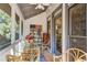Relaxing screened porch with furniture, ceiling fan, and decor for comfortable outdoor living at 1015 Heatherbrooke Ln, Atlanta, GA 30324