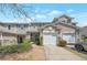 Exterior view of townhome with attached garage at 310 Oak Leaf Pl, Acworth, GA 30102