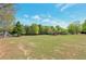 Expansive green space surrounded by mature trees, with gazebo in the distance at 310 Oak Leaf Pl, Acworth, GA 30102