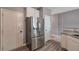 Bright kitchen with stainless steel refrigerator and white cabinets, offering both style and functionality at 310 Oak Leaf Pl, Acworth, GA 30102