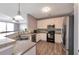 Modern kitchen featuring stainless steel appliances, updated cabinets, and a breakfast bar at 310 Oak Leaf Pl, Acworth, GA 30102