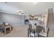 Inviting living room featuring an open layout, a dining table, and a staircase to the upper floor at 310 Oak Leaf Pl, Acworth, GA 30102