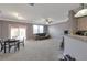 Spacious living room featuring sliding glass doors, a comfortable sofa, and ample natural light at 310 Oak Leaf Pl, Acworth, GA 30102
