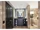 Stylish bathroom with dark wood cabinetry, a unique sink, and high-end finishes at 3475 Oak Valley Ne Rd # 1720, Atlanta, GA 30326
