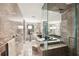 Spa-like bathroom with marble tiling, a soaking tub, and a glass-enclosed shower at 3475 Oak Valley Ne Rd # 1720, Atlanta, GA 30326