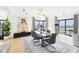 Bright dining room features modern lighting, large windows and gray color accents at 3475 Oak Valley Ne Rd # 1720, Atlanta, GA 30326