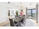 Dining area with modern table, stylish chairs, and expansive city views at 3475 Oak Valley Ne Rd # 1720, Atlanta, GA 30326