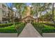 Beautifully landscaped pathway leading to a building entrance, surrounded by greenery and trees at 3475 Oak Valley Ne Rd # 1720, Atlanta, GA 30326