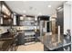 Modern kitchen with stainless appliances, custom cabinets, and breakfast bar seating at 3475 Oak Valley Ne Rd # 1720, Atlanta, GA 30326
