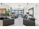 Living room showcasing stylish gray armchairs, modern lighting, and large windows with city views at 3475 Oak Valley Ne Rd # 1720, Atlanta, GA 30326