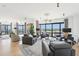 Spacious living room with ample seating, city views from large windows, and contemporary decor at 3475 Oak Valley Ne Rd # 1720, Atlanta, GA 30326