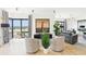 Living room featuring floor-to-ceiling windows, hardwood floors, and comfortable seating at 3475 Oak Valley Ne Rd # 1720, Atlanta, GA 30326
