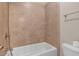 Bathroom features ceramic tiled shower/tub combination with white fixtures and a chrome towel rack at 3810 Baverton Dr, Suwanee, GA 30024