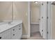 Well-lit bathroom featuring dual sinks and vanity with white cabinets and modern fixtures at 3810 Baverton Dr, Suwanee, GA 30024