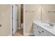 Bathroom features a white vanity with chrome fixtures and a ceramic tiled shower/tub combination in the background at 3810 Baverton Dr, Suwanee, GA 30024