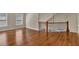 Spacious bonus room with hardwood floors and windows offering plenty of natural light at 3810 Baverton Dr, Suwanee, GA 30024