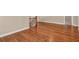 Open bonus area featuring rich hardwood flooring, clean baseboards and lots of light at 3810 Baverton Dr, Suwanee, GA 30024