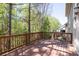 Enjoy nature views from this home's wooden deck overlooking mature trees at 3810 Baverton Dr, Suwanee, GA 30024