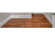 Rich hardwood flooring is beautifully showcased, accented by a clean white baseboard at 3810 Baverton Dr, Suwanee, GA 30024